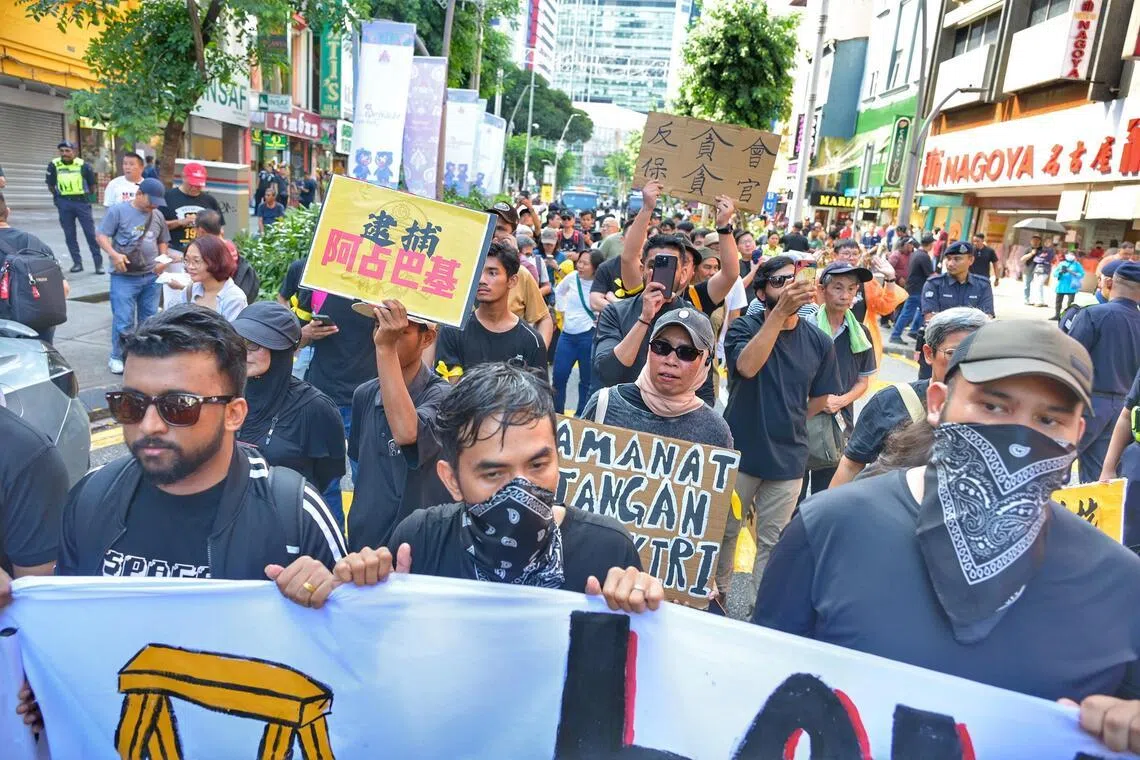 Malaysia’s Anwar to drop anti-graft chief, but protesters want deeper reforms after corruption saga