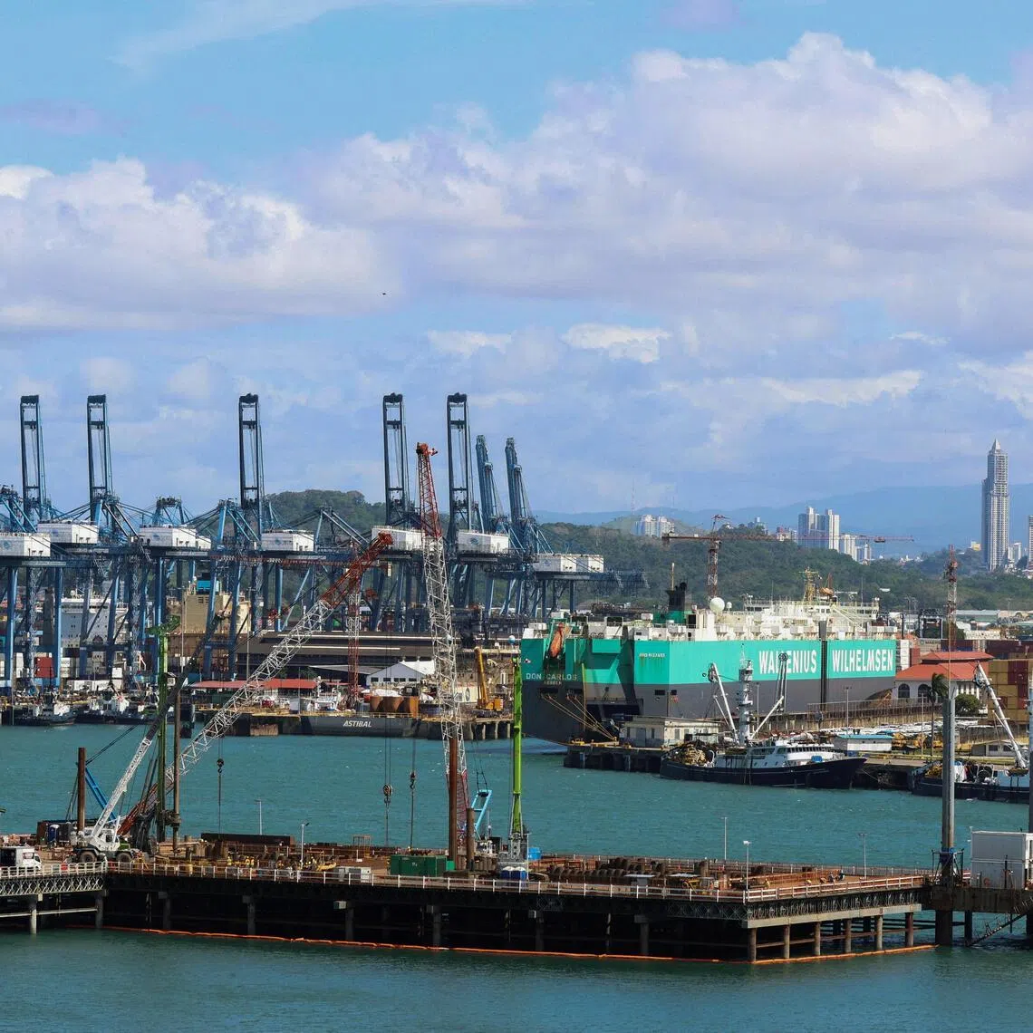 A container ship is docked at Panama Ports Company (PPC) after Panama’s Supreme Court annulled key port contracts held by the Hong Kong‑based CK Hutchison–owned firm, leaving the future of some Panama Canal operations uncertain, in Panama City, Panama, January 30, 2026. REUTERS/Aris Martinez REFILE - QUALITY REPEAT