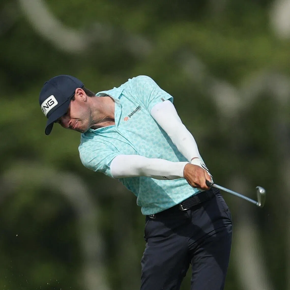 Alex Smalley of the United States hitting an approach shot on the 10th hole during the third round of the PGA Championship at Aronimink Golf Club on May 16.