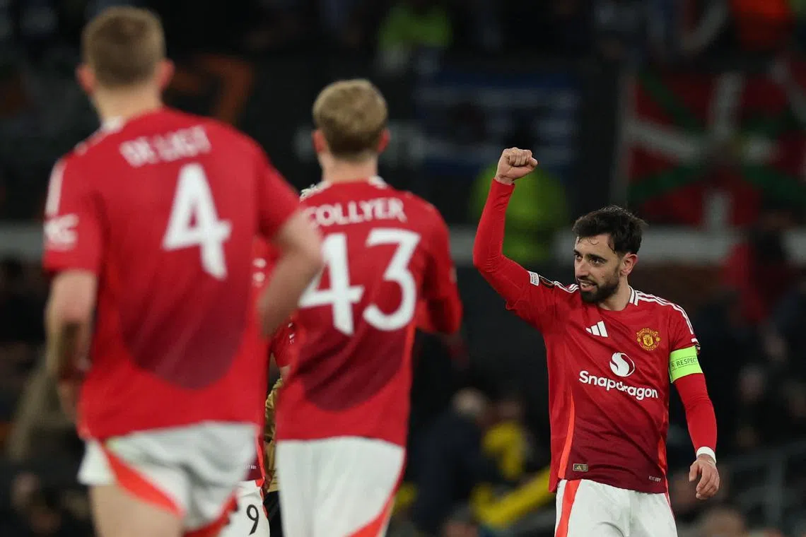 Soccer Football - Europa League - Round of 16 - Second Leg - Manchester United v Real Sociedad - Old Trafford, Manchester, Britain - March 13, 2025  Manchester United's Bruno Fernandes celebrates scoring their third goal and completes his hat-trick REUTERS/Phil Noble