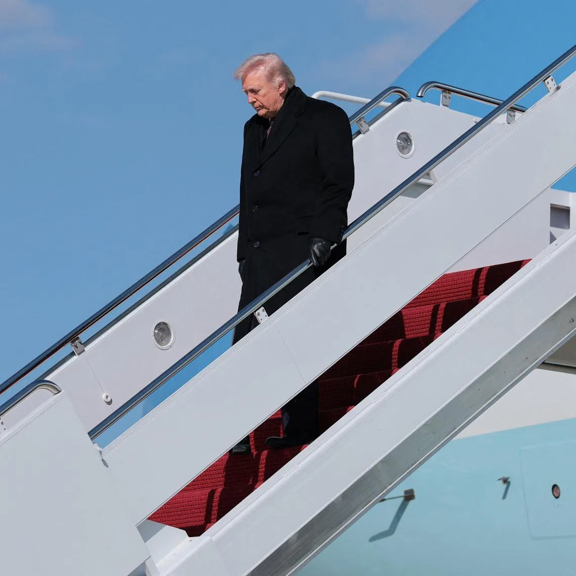 U.S. President Donald Trump disembarks Air Force One as he arrives at Joint Base Andrews, Maryland, U.S., March 18, 2026.