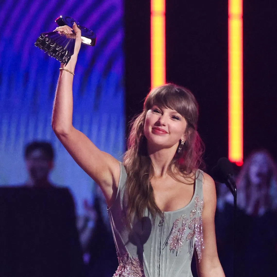 Taylor Swift accepts the Pop Album of the Year award, one of seven trophies she picked up, at the 2026 iHeartRadio Music Awards in Los Angeles on March 26.
