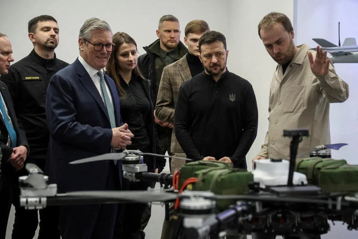 FILE PHOTO: British Prime Minister Keir Starmer and Ukraine's President Volodymyr Zelenskiy attend a presentation of Ukrainian military drones, amid Russia's attack on Ukraine, at an undisclosed location in Ukraine January 16, 2025.REUTERS/Oleksandr Ratushniak/File Photo