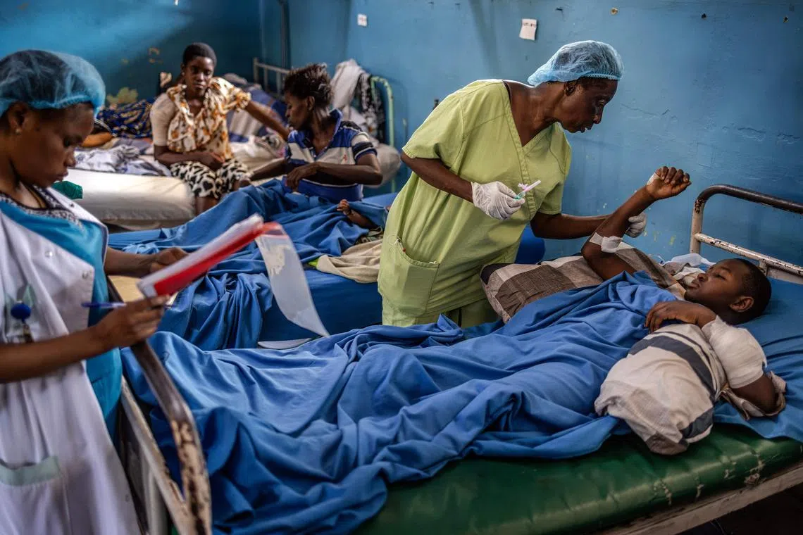 A nurse tending to the wounds of an injured woman following clashes in eastern Democratic Republic of Congo at the General Provincial Hospital in Bukavu, on Feb 19, 2025. 