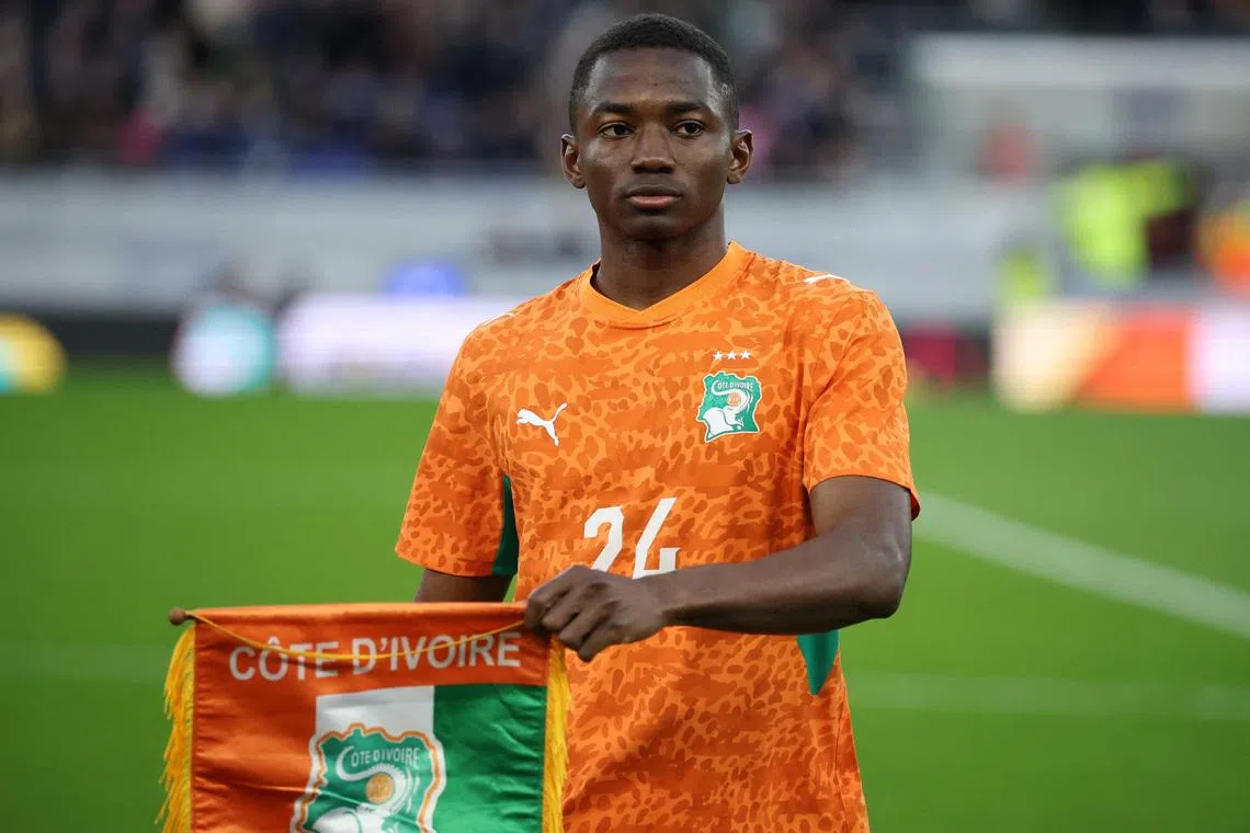 Soccer Football - International Friendly - Scotland v Ivory Coast - Hill Dickinson Stadium, Liverpool, Britain- March 31, 2026  Ivory Coast's Bazoumana Toure holds a pennant before the match REUTERS/Phil Noble