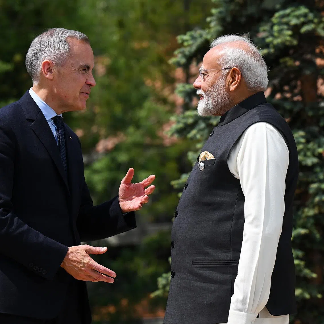 Canadian PM Mark Carney (left) greeting Indian PM Narendra Modi at the Group of Seven Leaders’ Summit in Canada in 2025. Mr Carney is scheduled to travel on to New Delhi for talks with Mr Modi.