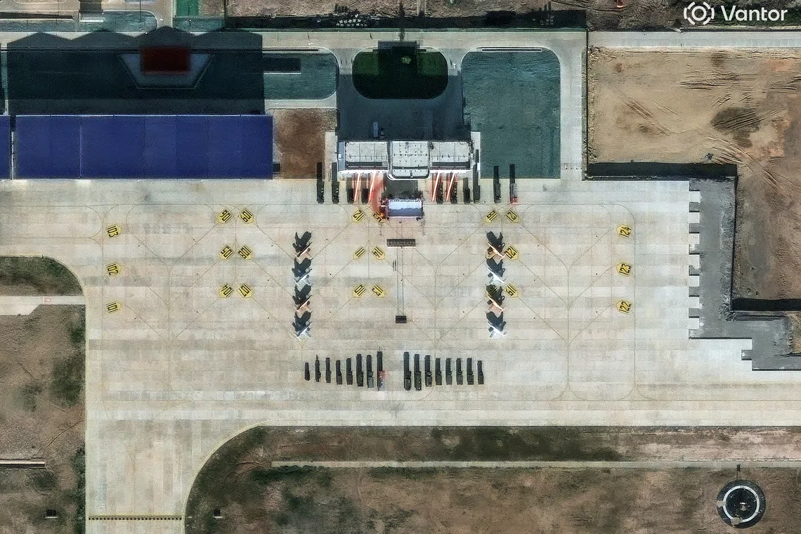 A satellite image showing what security analysts believe are Y-8 light attack fighters and support vehicles at a new China-Laos joint training facility in Ban Keun on Sept 30.