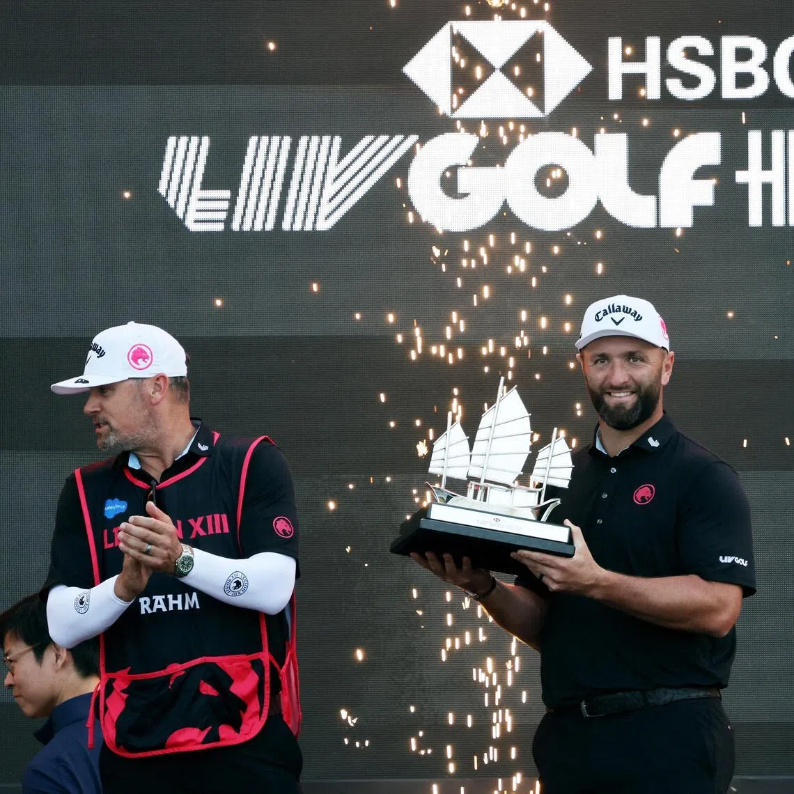 Legion XIII's Jon Rahm celebrating with the trophy after winning LIV Golf Hong Kong in March 2026.