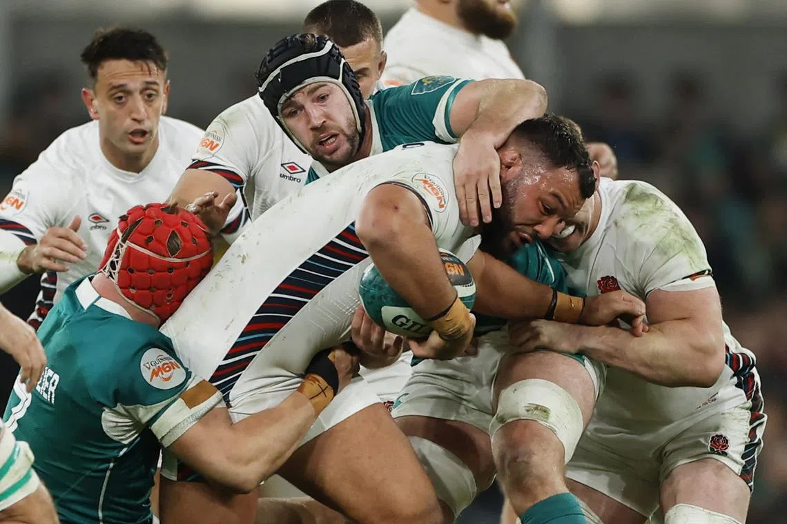 Rugby Union - Six Nations Championship - Ireland v England - Aviva Stadium, Dublin, Ireland - February 1, 2025 England's Ellis Genge in action with Ireland's Josh van der Flier and Ireland's Caelan Doris REUTERS/Clodagh Kilcoyne