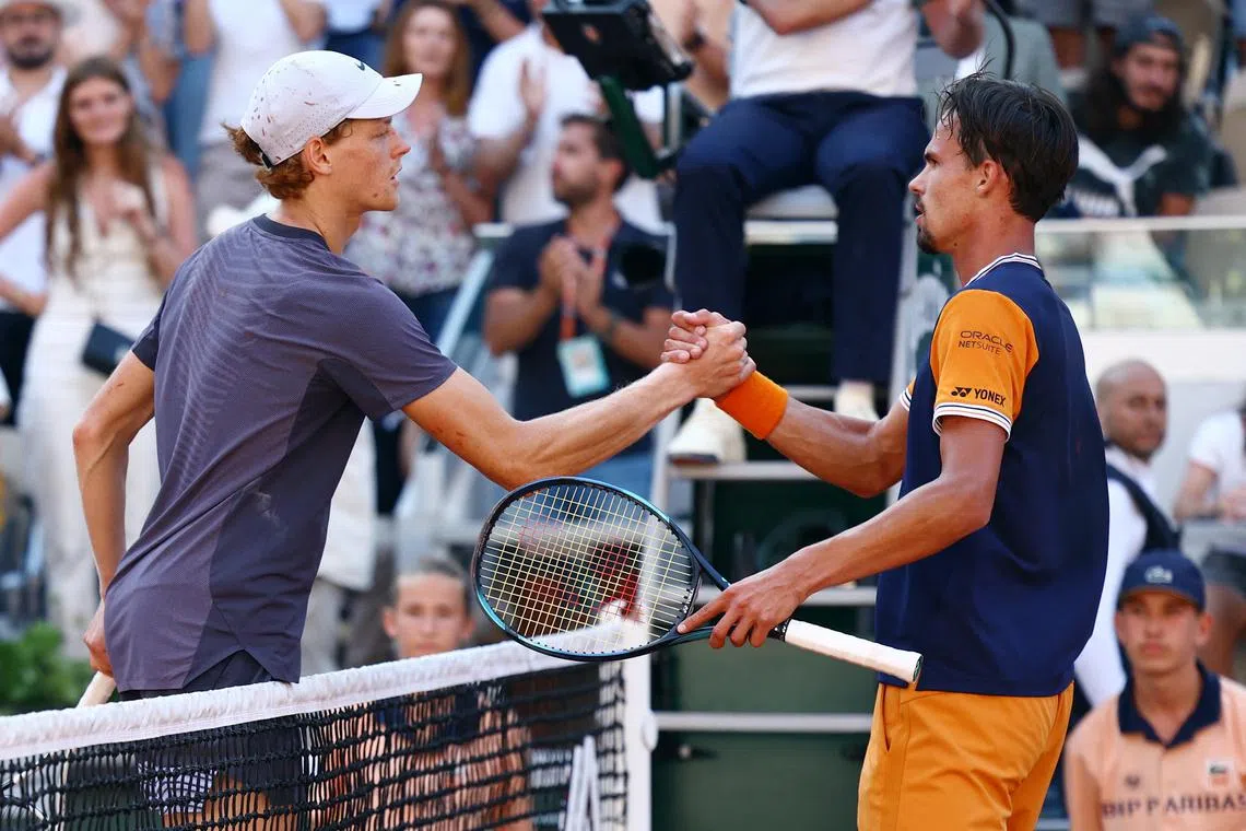 Sinner (left) was not his dominant self as he bowed out after five hours 26 minutes against Germany's Daniel Altmaier.