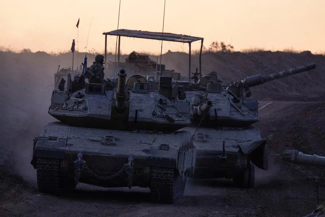 Tanks manoeuvre near Gaza border, amid the ongoing conflict in Gaza between Israel and Hamas, in Israel, December 16, 2024. REUTERS/Amir Cohen