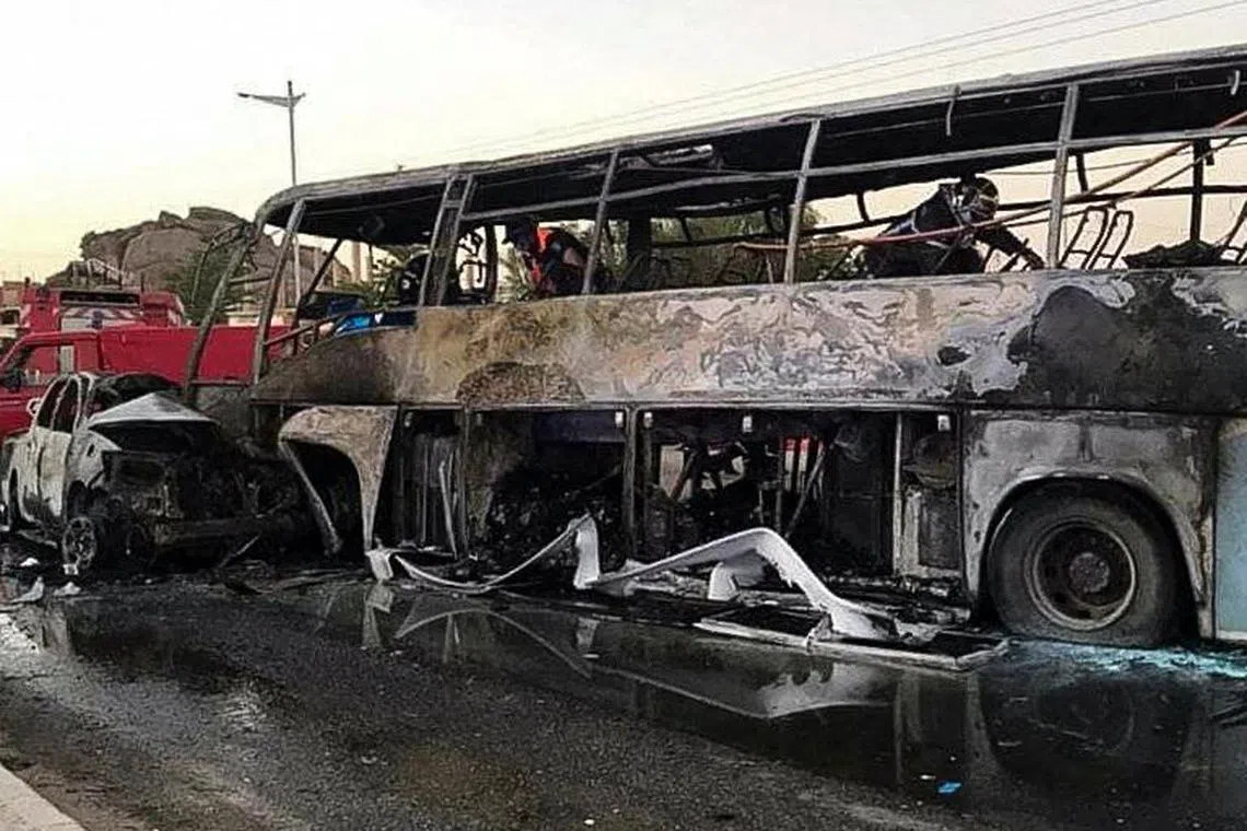 A view of a burnt bus and vehicle at the site of a road crash, in the city of Tamanrasset, Algeria in this handout picture obtained by Reuters on July 19, 2023. Algerian Civil Protection/Handout via REUTERS ATTENTION EDITORS - THIS IMAGE WAS PROVIDED BY A THIRD PARTY    NO RESALES. NO ARCHIVES.  THIS PICTURE WAS PROCESSED BY REUTERS TO ENHANCE QUALITY. AN UNPROCESSED VERSION HAS BEEN PROVIDED SEPARATELY.   