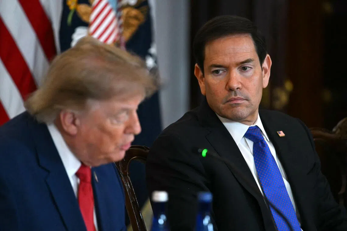 US Secretary of State Marco Rubio (right) listening as US President Donald Trump speaks during a roundtable event in Washington, DC, on Aug 7.