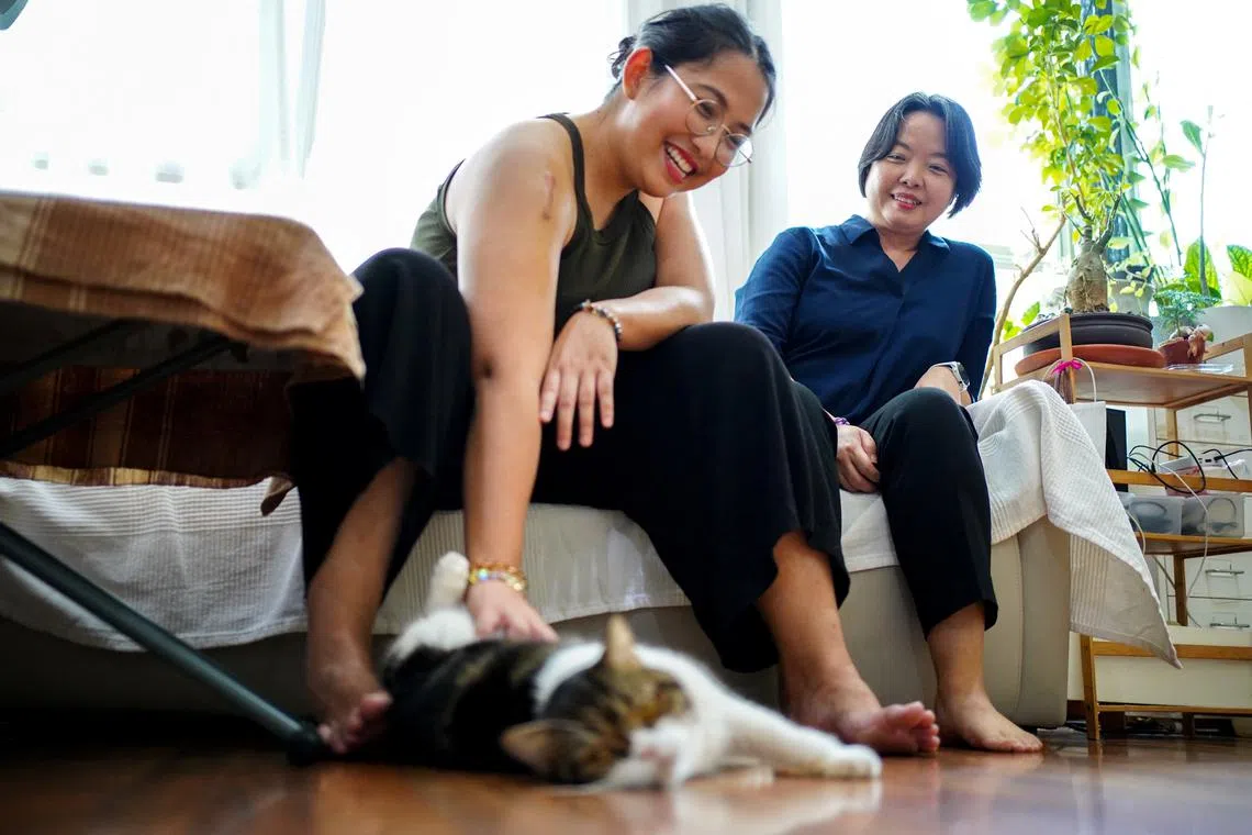 Vorawan \"Beaut\" Ramwan and Anticha \"An\" Sangchai spend time together during an interview with Reuters at their house, before a bill on equality heads for final readings in the Southeast Asian country's Senate on June 18, if passed, Thailand will become the first country in Southeast Asia to legalize same-sex unions, in Bangkok, Thailand, June 11, 2024. REUTERS/Athit Perawongmetha