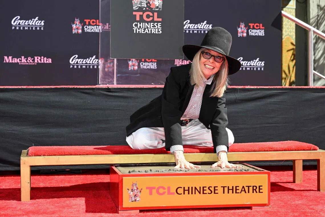 Actress Diane Keaton preserves her hands in cement at the handprints and footprints ceremony to celebrate Mack & Rita at TCL Chinese Theatre in Hollywood, California, on August 11, 2022. 