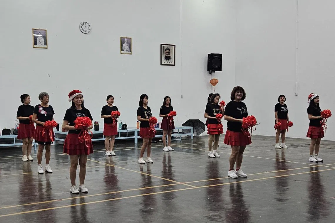 whclan11 - 193145 - A dozen Taiping Tsen Loong Association female members are rehearsing a dance for the anniversary dinner under 

Credit: ST/Lu Wei Hoong