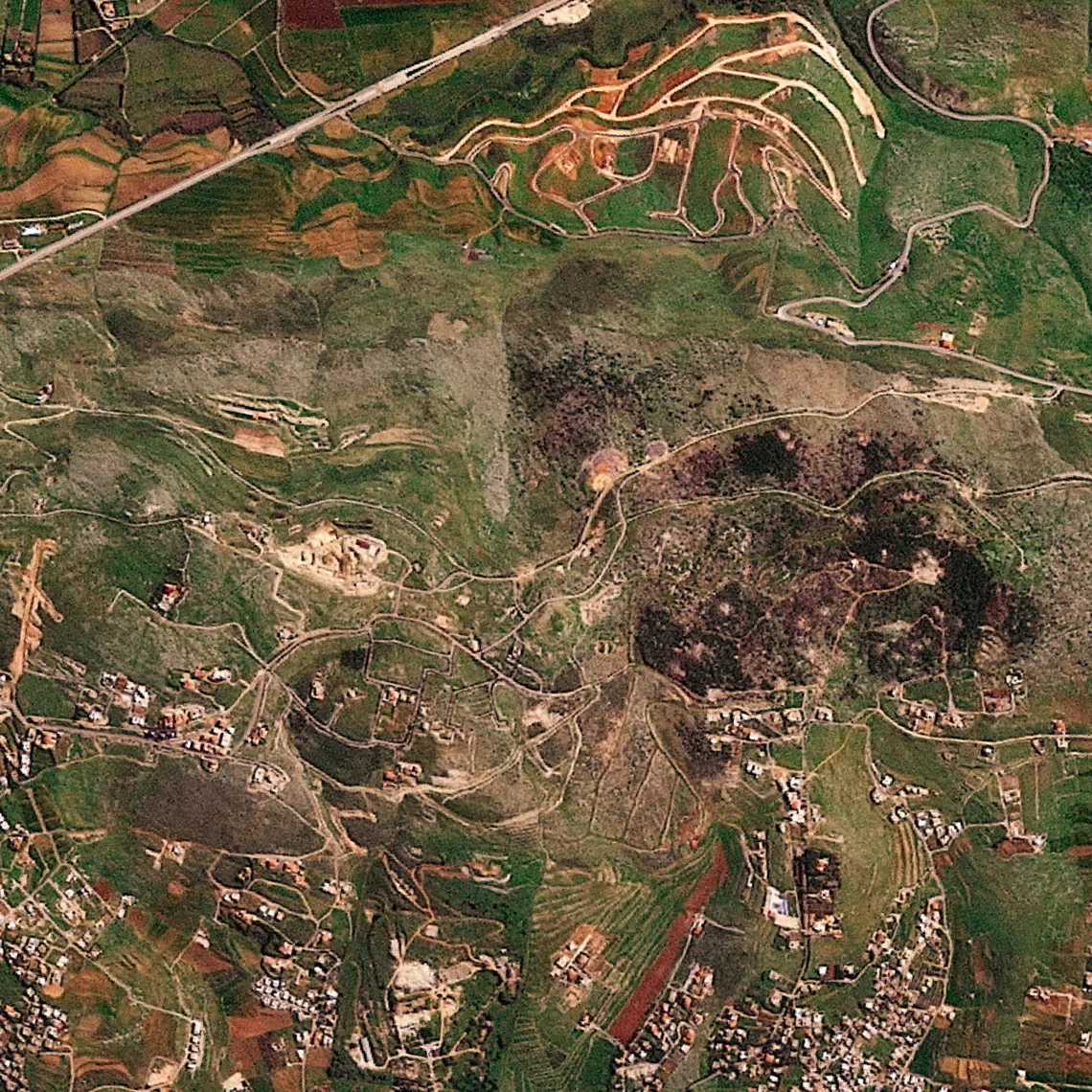 A satellite image shows damage at the Ali al-Taher ridge near Nabatiah, Lebanon, March 8, 2026. 2026 Planet Labs PBC/Handout via REUTERS