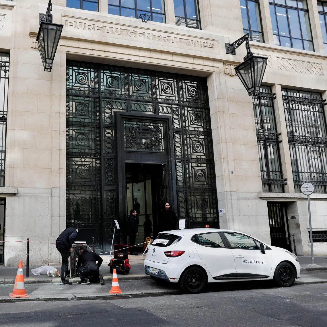 Private security members gather outside Bank of America’s Paris offices, after French anti-terrorism prosecutors opened an investigation into attempted destruction by fire or other dangerous means in Paris, France, March 30, 2026. REUTERS/Benoit Tessier