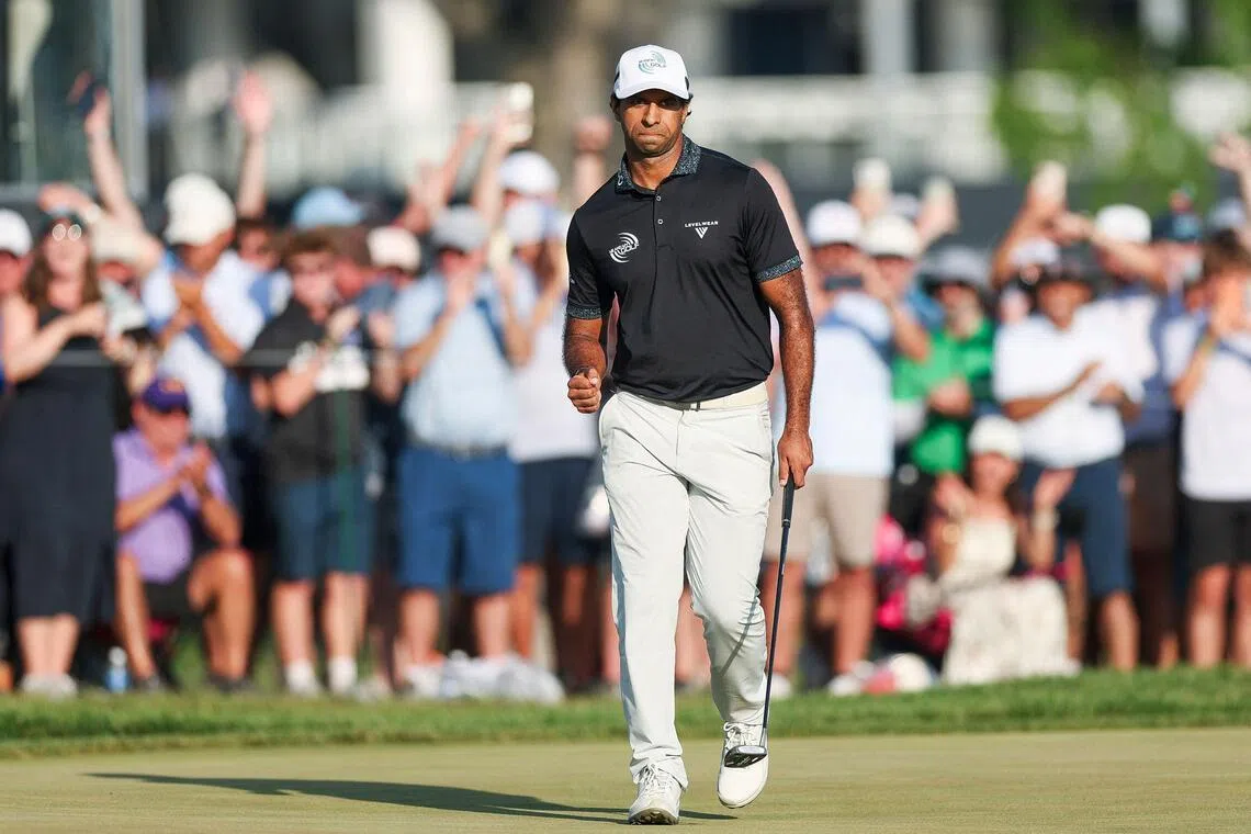 Aaron Rai of England celebrates after a putt on the 17th green during the final round of the PGA Championship at Aronimink Golf Club.