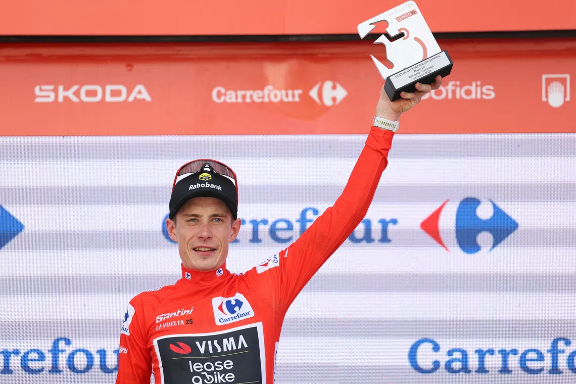 FILE PHOTO: Cycling - Vuelta a Espana - Stage 18 - Valladolid to Valladolid - Valladolid, Spain - September 11, 2025 Team Visma | Lease a Bike's Jonas Vingegaard celebrates on the podium wearing the red jersey after stage 18 REUTERS/Juan Medina/ File Photo