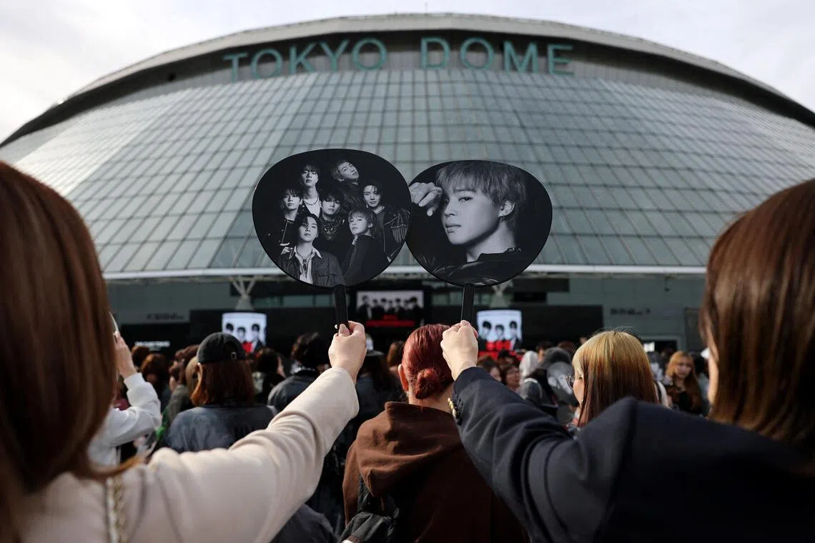 Fans of South Korean K-pop boy band BTS throng around the Tokyo Dome before the start of the band's concert, in Tokyo, Japan, on April 17, 2026. 
