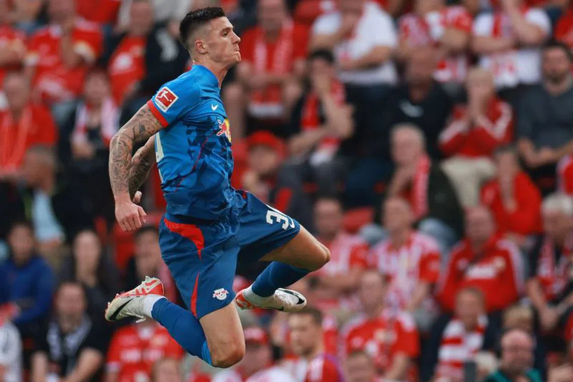 FILE PHOTO:Soccer Football - Bundesliga - 1. FC Union Berlin v RB Leipzig - Stadion An der Alten Forsterei, Berlin, Germany - September 3, 2023 RB Leipzig&#039;s Benjamin Sesko celebrates scoring their second goal REUTERS/Lisi Niesner/File Photo
