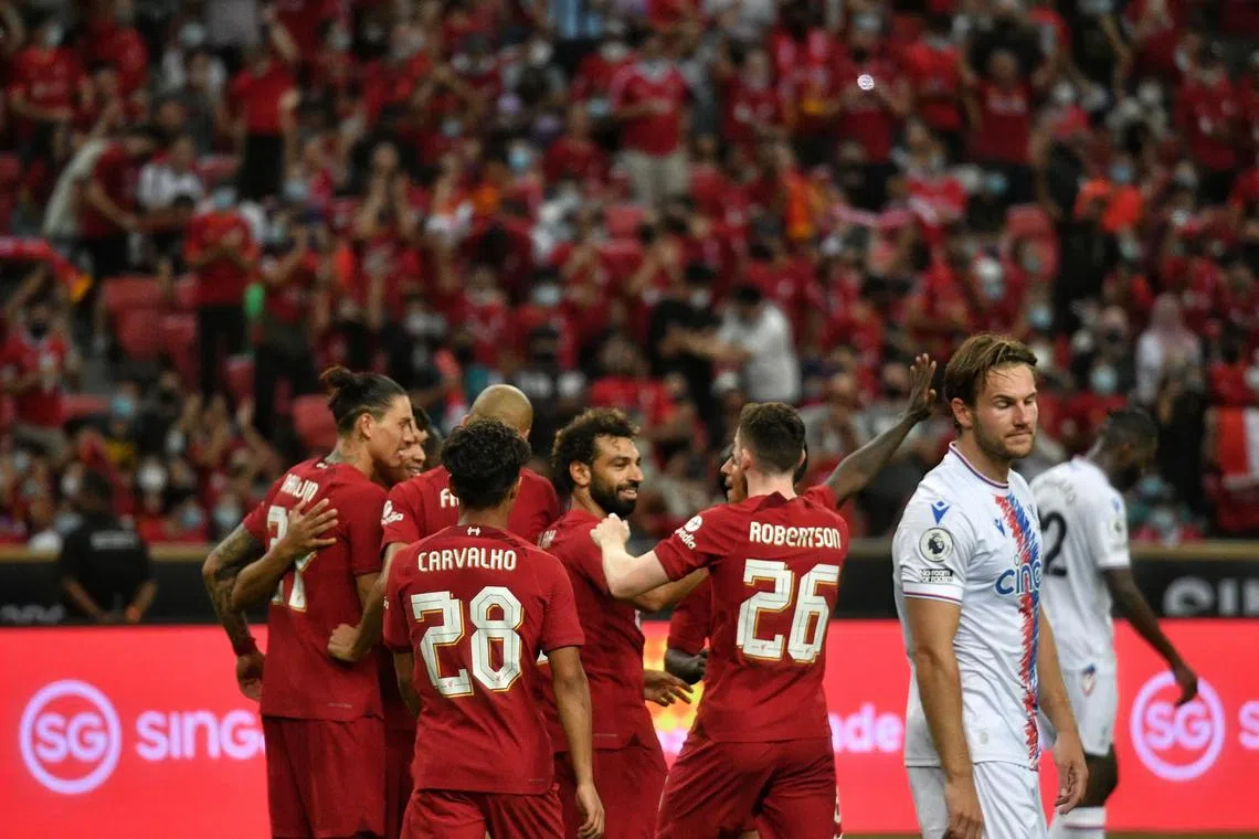 Liverpool teammates congratulating Mohamed Salah after he scored the second goal in the 2-0 pre-season friendly win over Crystal Palace at the Standard Chartered Singapore Trophy 2022 on 15 July 2022.