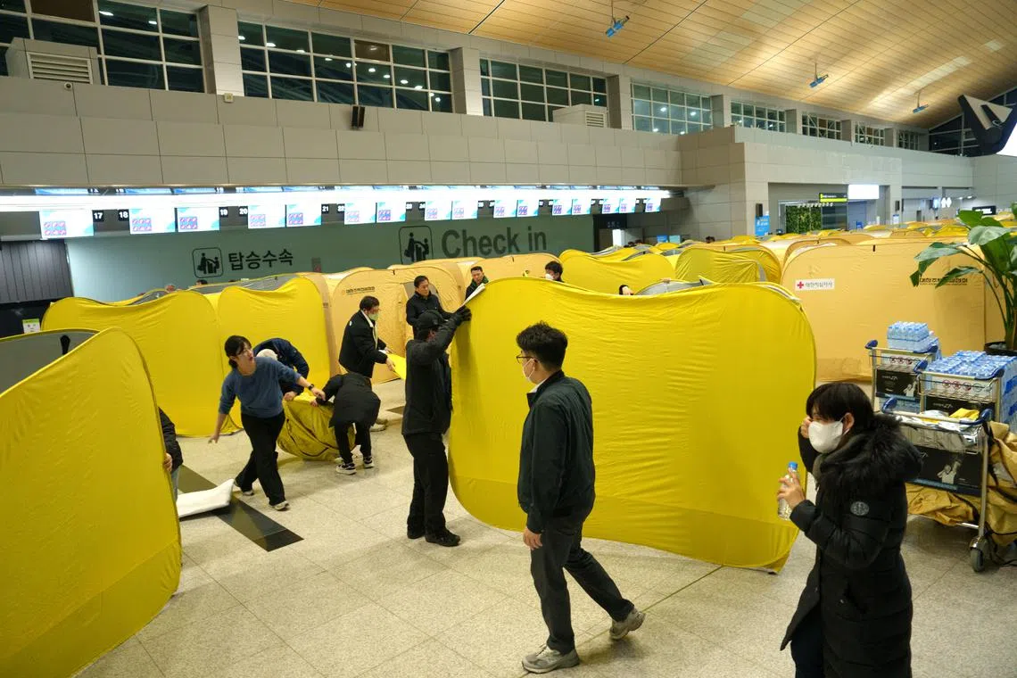 Portable tents set up at Muan International Airport to create privacy spaces for relatives of victims of the plane crash.