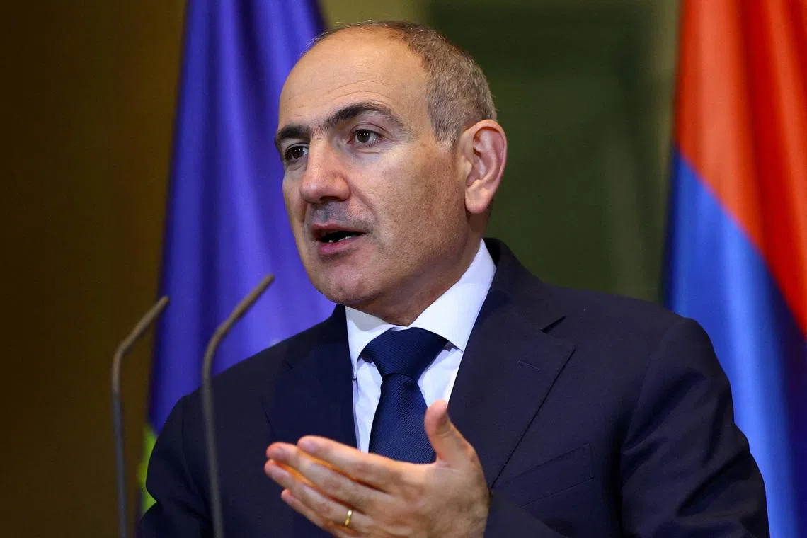 FILE PHOTO: Armenian Prime Minister Nikol Pashinyan speaks during a press conference with German Chancellor Friedrich Merz (not pictured) at the Chancellery in Berlin, Germany December 9, 2025.  REUTERS/Lisi Niesner/File Photo