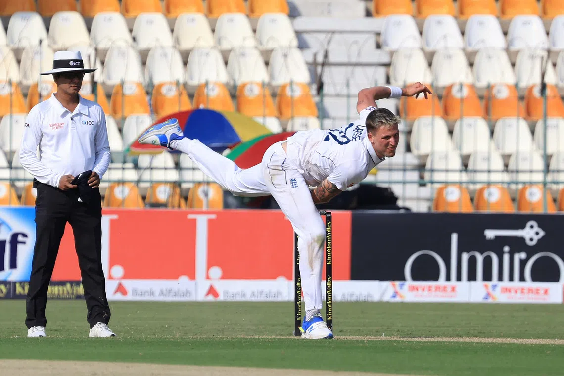 Cricket - First Test - England v Pakistan - Multan Cricket Stadium, Multan, Pakistan - October 7, 2024 England's Brydon Carse in action REUTERS/Akhtar Soomro