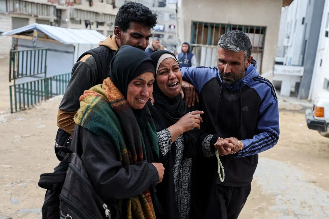 Mourners react during the funeral of two Palestinians killed by an Israeli strike on Thursday, according to medics, at Shifa hospital in Gaza City, February 26, 2026. REUTERS/Dawoud Abu Alkas