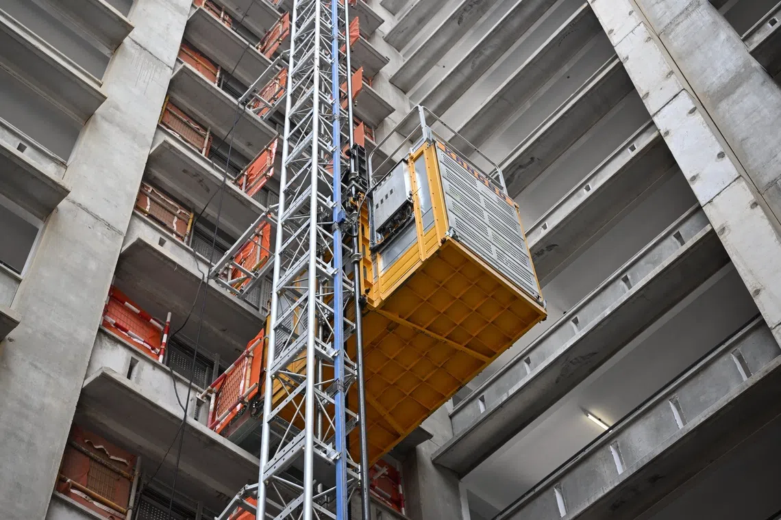 Smart hoists – a temporary lifting system installed on the outside of a building – will be used at about half of BTO sites tendered from 2027, to free up workers for other tasks.