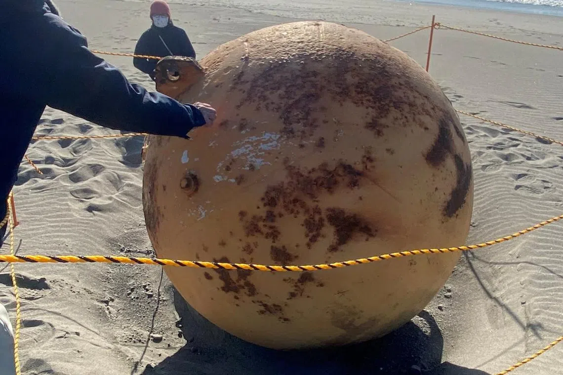 The russet sphere appeared to be rusty and made of metal.