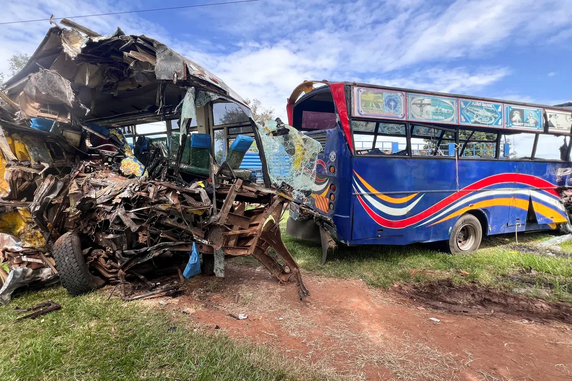 Wreckage of public transport buses involved in a head-on collision is parked at a police station near the scene of the deadly crash on the Kampala-Gulu highway in Kiryandongo district, near Gulu, northern Uganda, October 22, 2025. REUTERS/Stringer