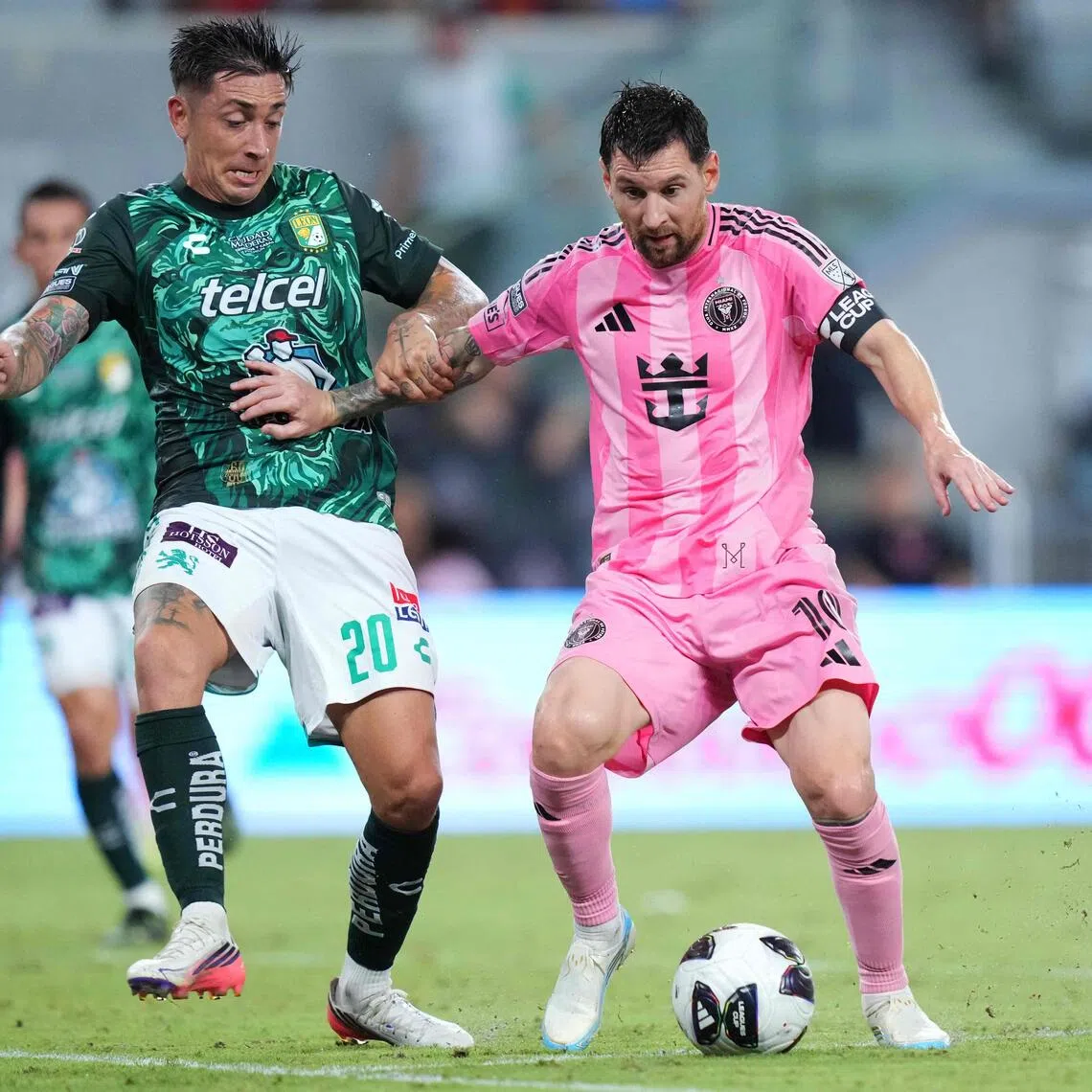 Inter Miami’s Lionel Messi taking on Rodrigo Echeverria of Leon in a Leagues Cup match on Aug 12.