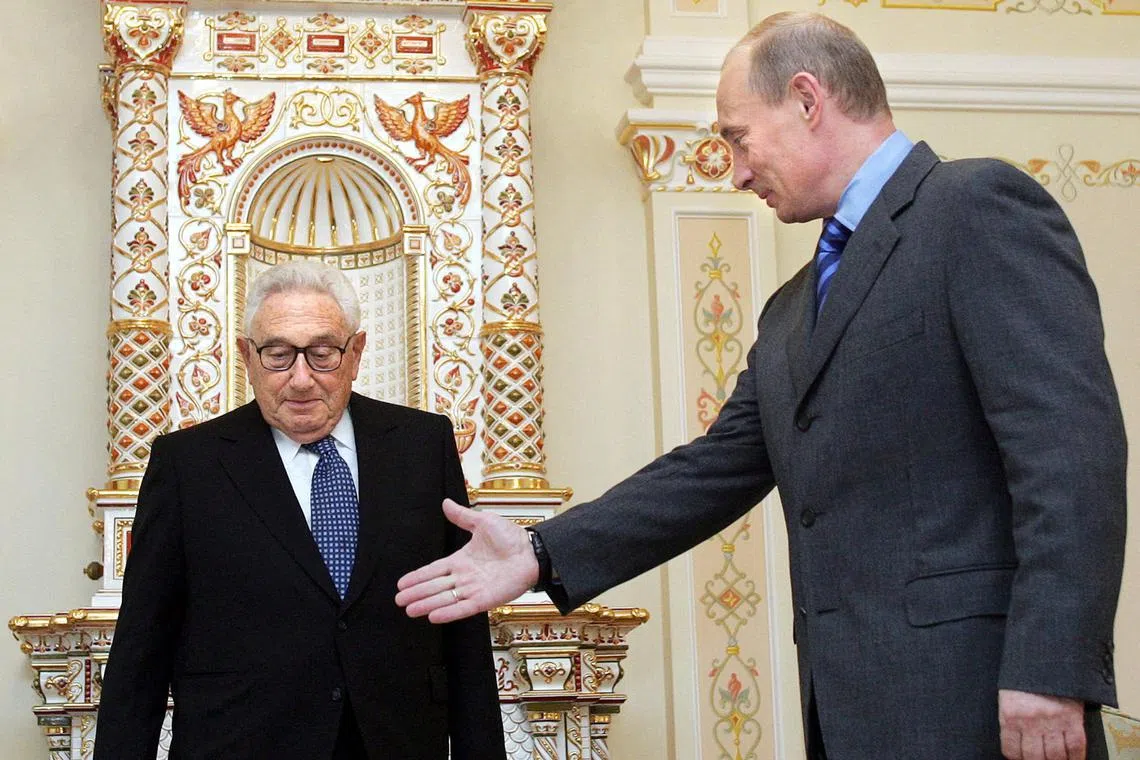 (FILES) Russian President Vladimir Putin (R) welcomes former US Secretary of State Henry Kissinger during their meeting at the Novo-Ogaryovo residence outside Moscow on June 06, 2006. Henry Kissinger, whose very name is synonymous with US diplomacy, turns 100 on May 27, 2023, feted by the American elite as others seethe that the ruthless Cold Warrior has never faced accountability.
From opening the door to communist China to plotting an endgame to the Vietnam War to unapologetically backing dictators who were anti-Soviet, Kissinger wielded influence like few before or after him, serving as both top diplomat and security advisor to presidents Richard Nixon and Gerald Ford.
Instantly recognizable for his bookishly thick glasses and a sharp-witted monotone that never lost a touch of his native German, Kissinger was first an academic and his intellectual gifts are acknowledged begrudgingly even by some of his harshest critics. (Photo by DENIS SINYAKOV / AFP)