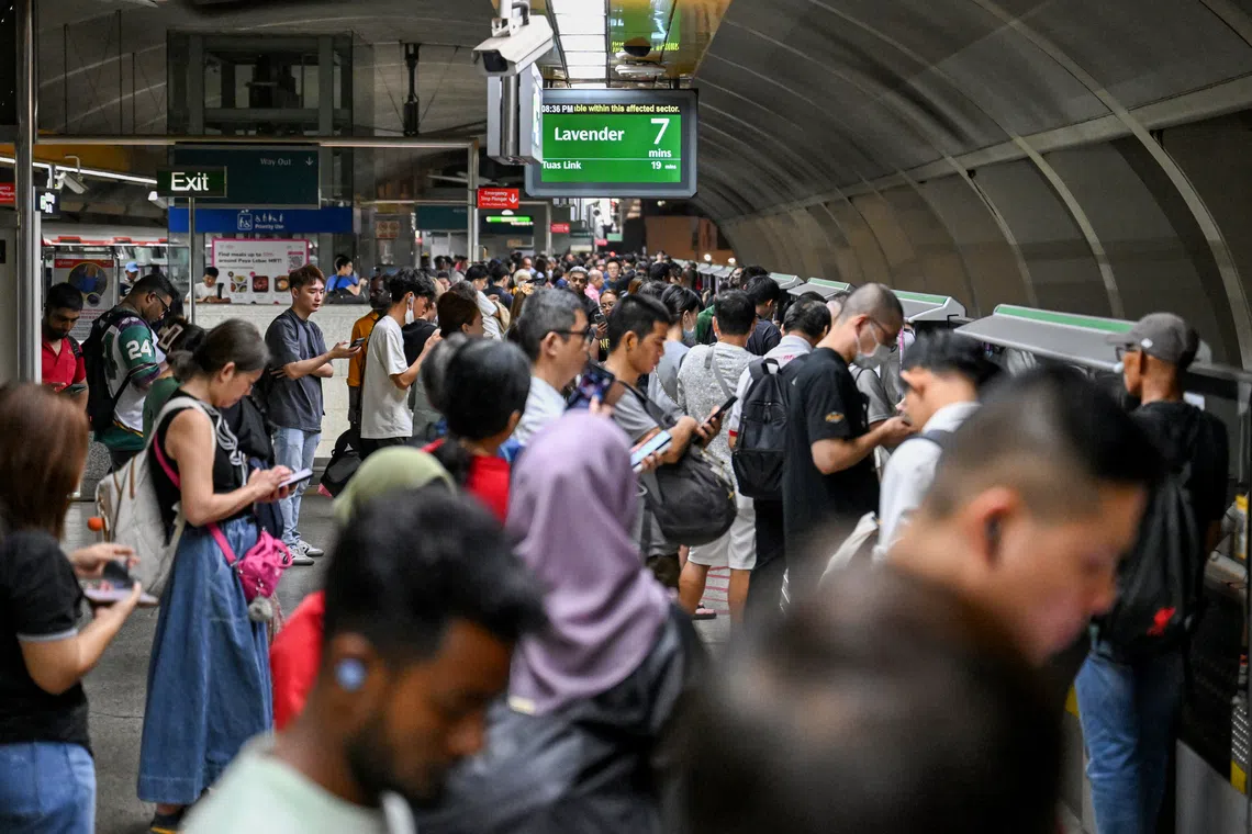 Commuters at Kallang MRT station waiting for a train after the announcement of a train fault on Dec 2.
