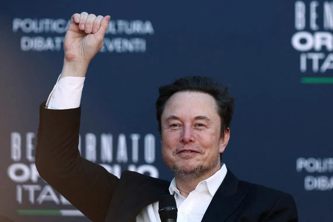 FILE PHOTO: Tesla and SpaceX's CEO Elon Musk gestures, as he attends political festival Atreju organised by Italian Prime Minister Giorgia Meloni's Brothers of Italy (Fratelli d'Italia) right-wing party, in Rome, Italy, December 16, 2023. REUTERS/Guglielmo Mangiapane/File Photo