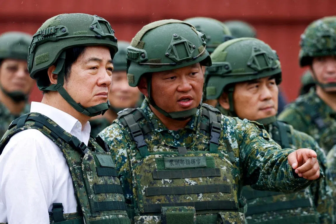 FILE PHOTO: A soldier speaks to Taiwan's President Lai Ching-te in Hsinchu, Taiwan July 10, 2025. REUTERS/Ann Wang/File Photo