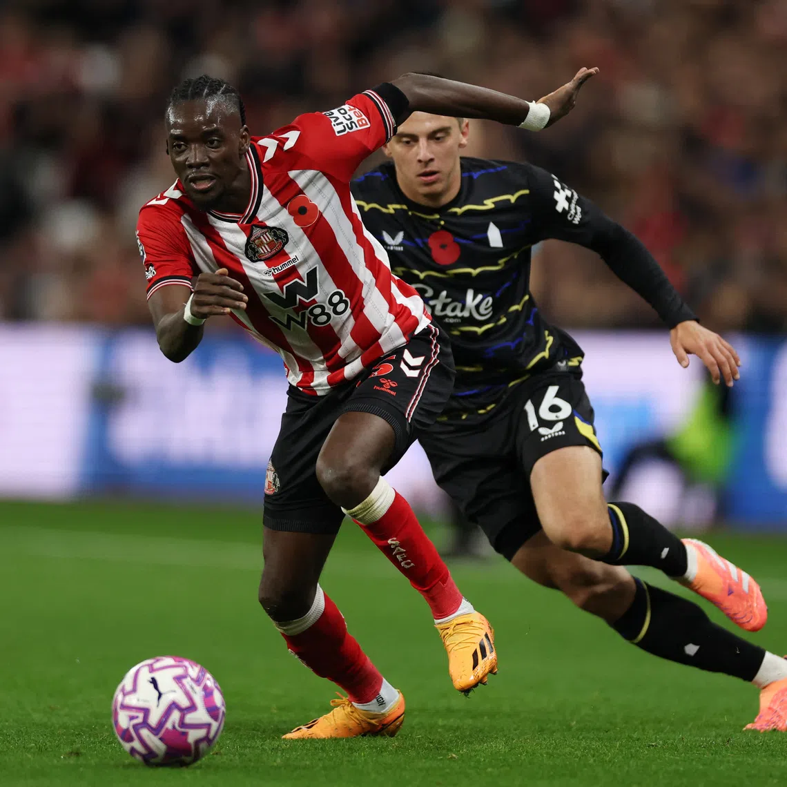 Soccer Football - Premier League - Sunderland v Everton - Stadium of Light, Sunderland, Britain - November 3, 2025 Sunderland's Bertrand Traore in action with Everton's Vitaliy Mykolenko Action Images via Reuters/Lee Smith