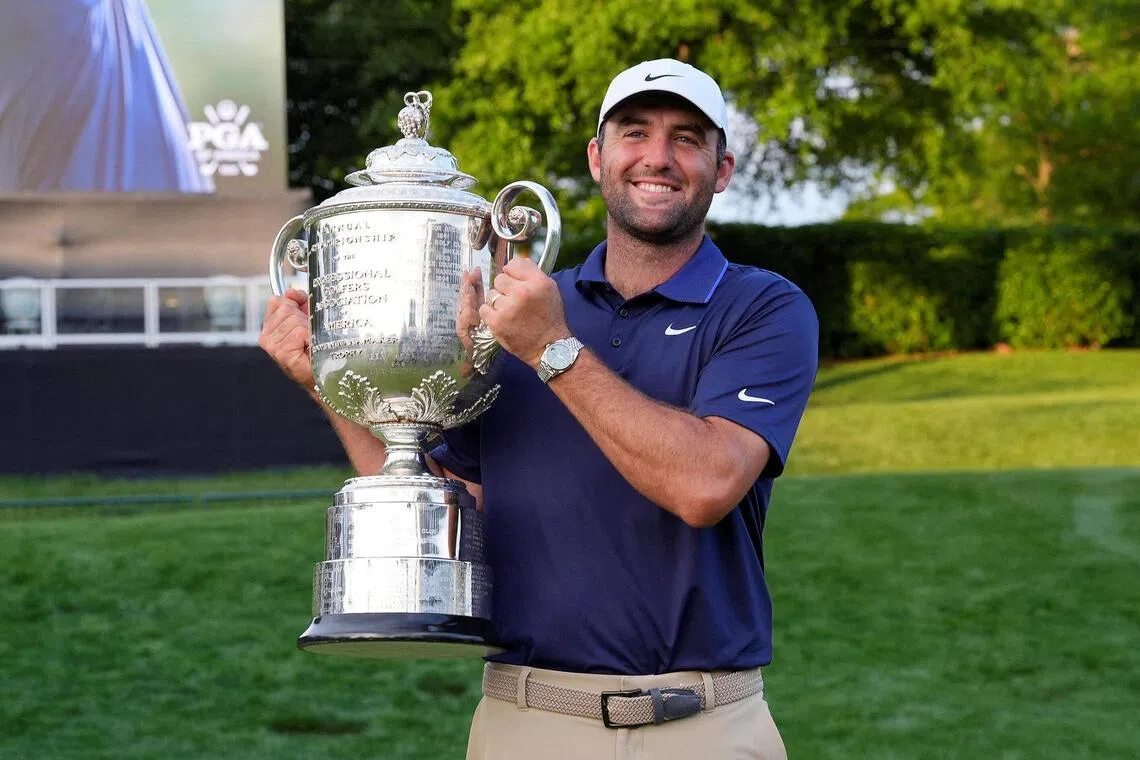 Scottie Scheffler poses for a photo with the Wanamaker Trophy after winning the PGA Championship golf tournament at Quail Hollow.