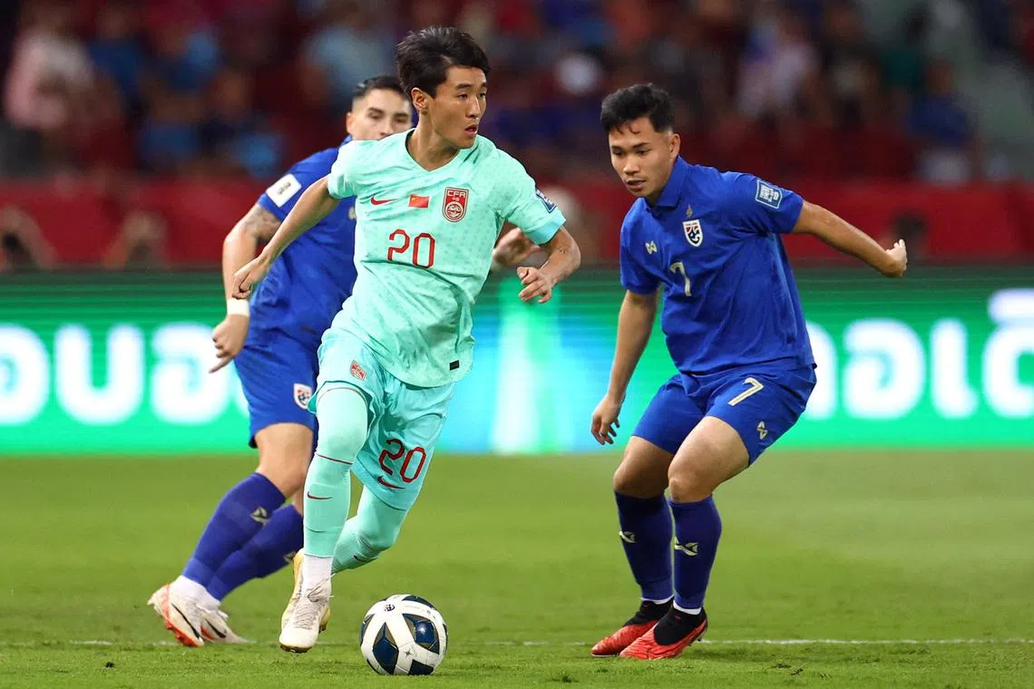 FILE PHOTO: Soccer Football - World Cup - AFC Qualifiers - Group C - Thailand v China - Rajamangala National Stadium, Bangkok, Thailand - November 16, 2023 Thailand's Supachok Sarachat in action with China's Wei Shihao REUTERS/Chalinee Thirasupa/File Photo