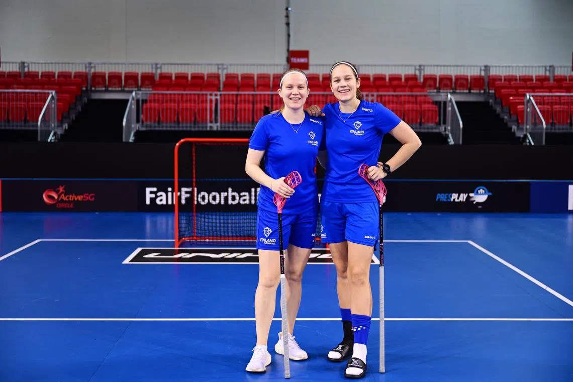 Finland floorball twins Oona (right) and Veera Kauppi, who are in Singapore for the Women's World Floorball Championship.
