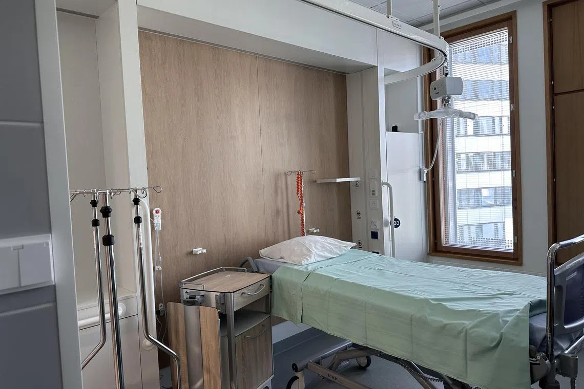 jtfinland31 - The room has a patient lift to aid nurses in transfering patients from the bed to the toilet.