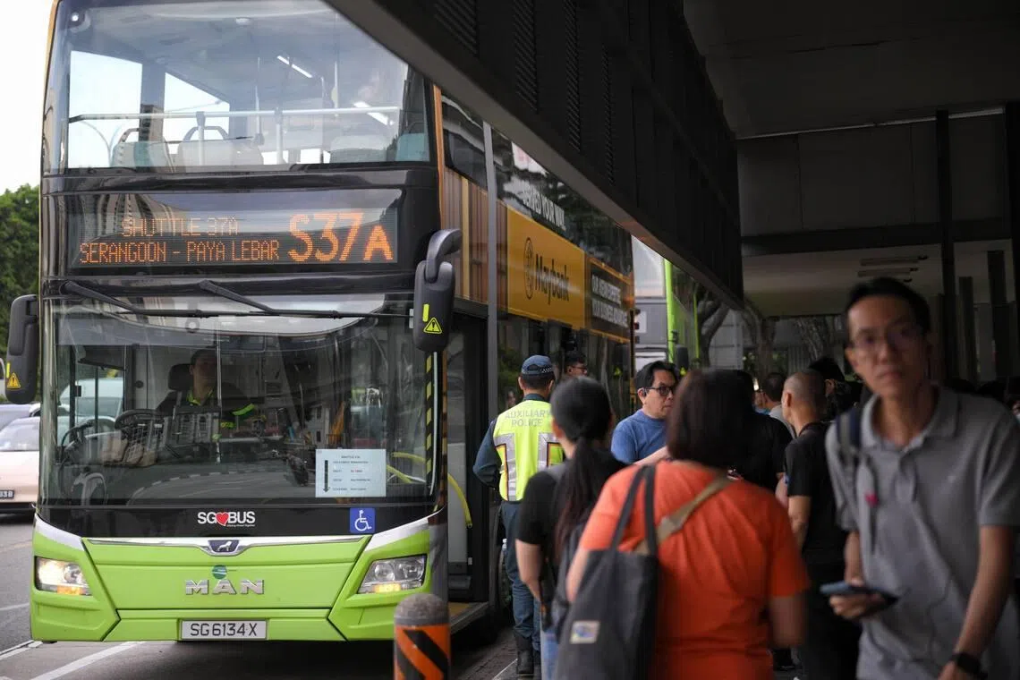 Commuters board a shuttle bus from Serangoon MRT Station to Paya Lebar MRT on Jan 19.