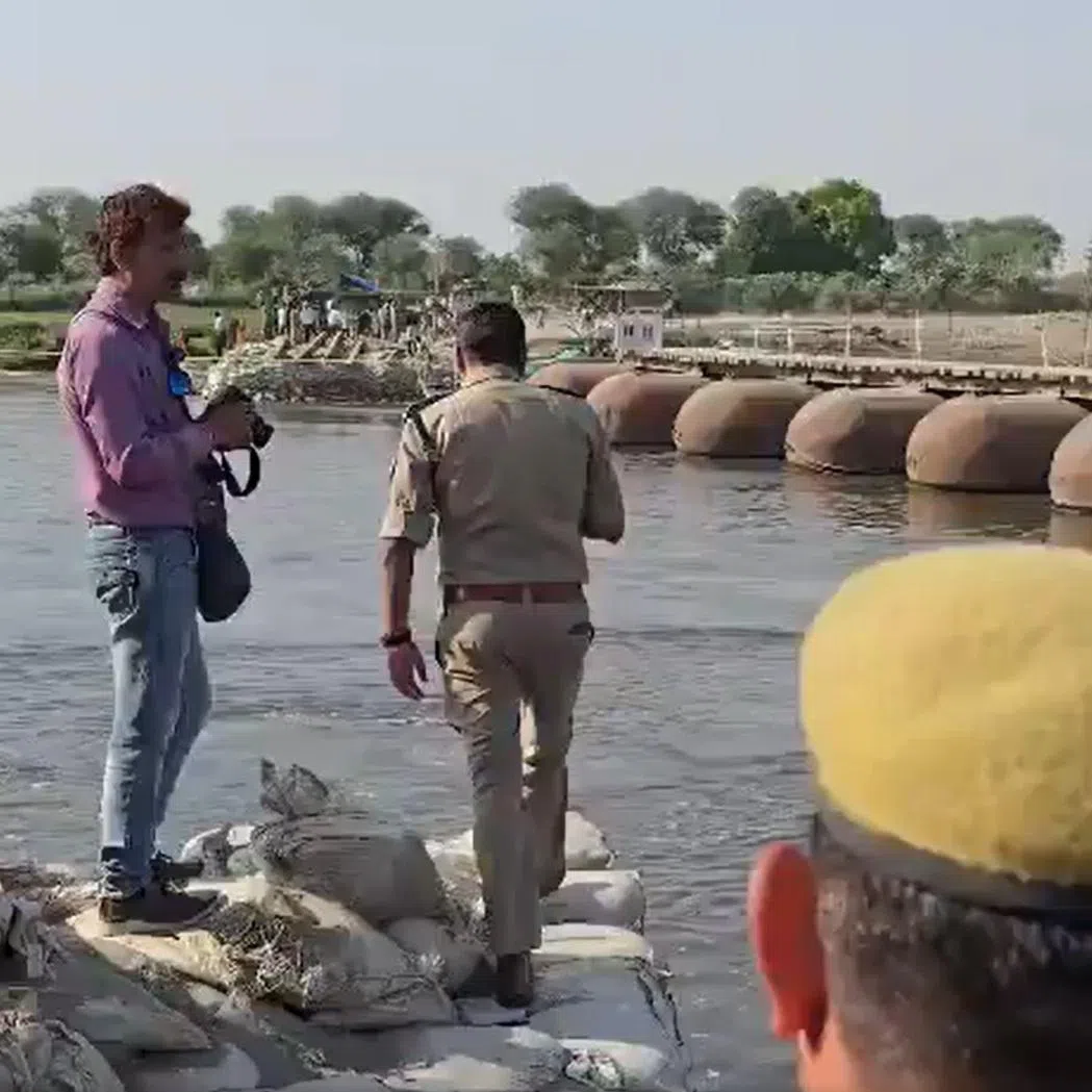The boat, carrying dozens of people, hit a pontoon bridge and capsized, on the Yamuna river in the town of Mathura.