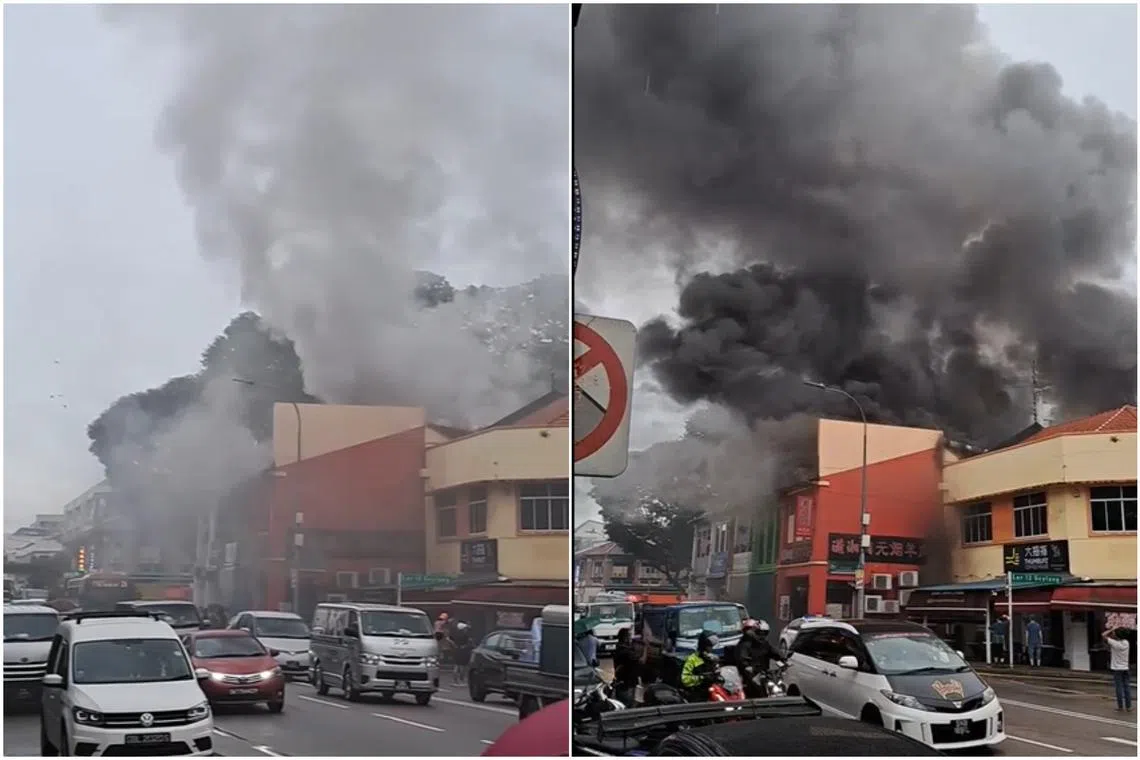 Black smoke could be seen billowing out the back of the shophouses along Geylang Road near the intersection of Geylang Lorong 12.
