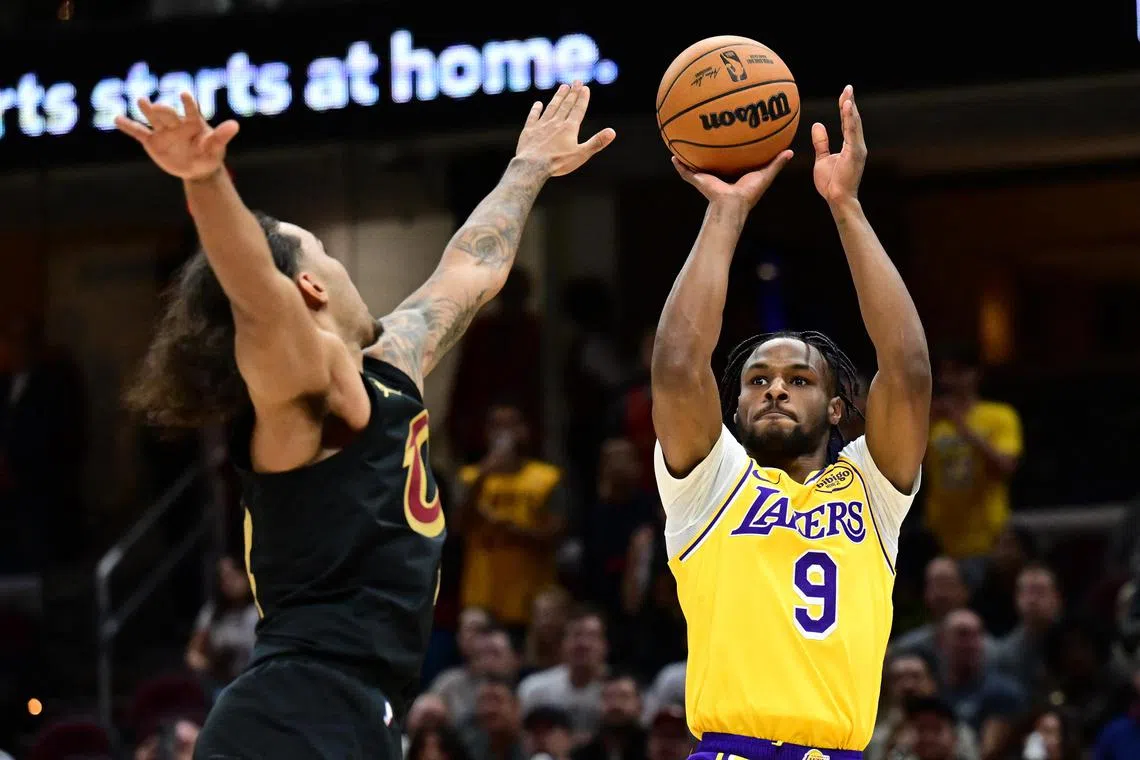 Los Angeles Lakers guard Bronny James shooting over Cleveland Cavaliers forward Jaylon Tyson in the second half at Rocket Mortgage FieldHouse on Oct 30. 