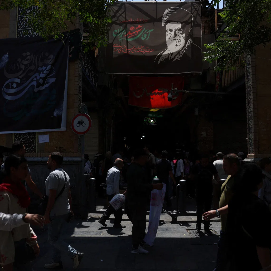 A banner depicting Iran’s late supreme leader Ayatollah Ali Khamenei in the Grand Bazaar in Tehran.