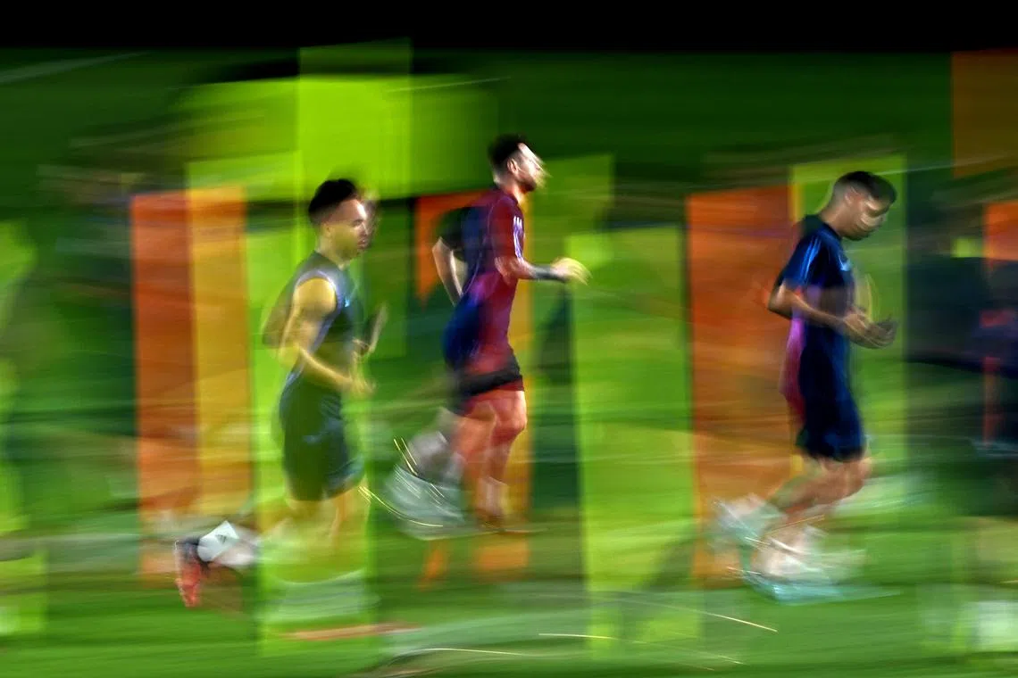 Argentina's Lionel Messi and Lautaro Martinez during training  n Doha, Qatar ahead of the clash with the Netherlands. PHOTO: REUTERS